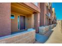 View of townhomes with a walkway, showcasing a modern design at 6745 N 93Rd Ave # 1138, Glendale, AZ 85305