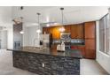 Modern kitchen with granite countertops and stainless steel appliances at 6745 N 93Rd Ave # 1138, Glendale, AZ 85305