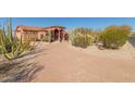 Landscaped front yard with gravel and desert plants leads to a beautiful home at 8540 E Mcdowell Rd # 55, Mesa, AZ 85207