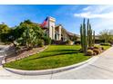 Stunning curb appeal with lush lawn, cacti, and flag at 10425 N 23Rd St, Phoenix, AZ 85028