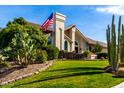 Lovely home exterior with desert landscaping and American flag at 10425 N 23Rd St, Phoenix, AZ 85028