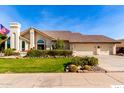 Beautiful home with landscaped yard, two-car garage, and desert landscaping at 10425 N 23Rd St, Phoenix, AZ 85028