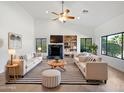 Spacious living room with fireplace and built-in shelving at 11722 E Starflower Dr, Chandler, AZ 85249