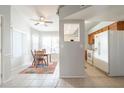 Inviting dining area with a ceiling fan adjacent to the kitchen, perfect for casual meals at 1240 W Straford Dr, Chandler, AZ 85224