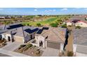 Luxury home with a solar panel system, situated on a golf course community at 19063 N 265Th Ave, Buckeye, AZ 85396