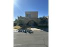 Tan stucco house with arched entryway and gated courtyard at 2145 E Donner Dr, Tempe, AZ 85282