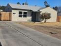 Single story home with tidy landscaping and a concrete driveway at 2324 W Luke Ave, Phoenix, AZ 85015