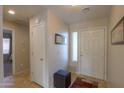 Bright entryway with tiled floors and coat closet at 2409 E Antigua Dr, Casa Grande, AZ 85194