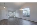 Bright living room with hardwood floors and large windows at 2438 W Gambit Trl, Phoenix, AZ 85085