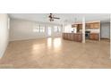 Open floor plan living area with tile floors and kitchen island at 2715 S Rita Ln, Tempe, AZ 85282