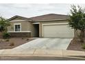 Charming single story home with a two-car garage and stone accents at 3014 N Majestic Ct, Casa Grande, AZ 85122