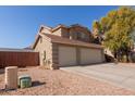 Two-story house with a two-car garage and a side yard at 31292 N Candlewood Dr, San Tan Valley, AZ 85143