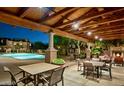 Community pool area with covered seating and fireplace at 3935 E Rough Rider Rd # 1191, Phoenix, AZ 85050
