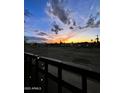 Stunning sunset view from a balcony overlooking a park-like setting at 4334 N 19Th Dr, Phoenix, AZ 85015