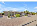 Brick ranch home with mature landscaping and a large front yard at 4725 E Capri Ave, Mesa, AZ 85206