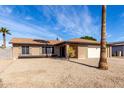 Lovely brick home with desert landscaping, charming window details and a welcoming entrance at 5114 W Corrine Dr, Glendale, AZ 85304