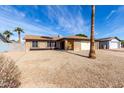 Inviting home with desert landscaping, a two-car garage, and window boxes adding charm at 5114 W Corrine Dr, Glendale, AZ 85304