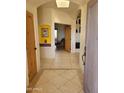 Bright entryway features tiled floors and neutral walls with view into an open-concept living space at 55823 N 329Th Dr, Wickenburg, AZ 85390