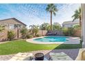 Enjoy this refreshing pool with a spacious patio area at 5613 N Laguna Ct, Litchfield Park, AZ 85340