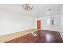 Living room with tile flooring and an orange door at 7411 W Alta Vista Rd, Laveen, AZ 85339