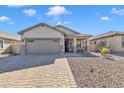 Single-story home with a two-car garage and desert landscaping at 789 E Blossom Rd, San Tan Valley, AZ 85143