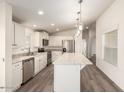 Modern kitchen featuring white cabinets, stainless steel appliances, and an island at 11596 W Sierra Dawn Blvd # 5, Surprise, AZ 85378