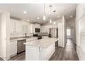 Modern kitchen featuring white cabinets, stainless steel appliances, and an island at 11596 W Sierra Dawn Blvd # 5, Surprise, AZ 85378