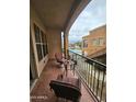 Relaxing balcony featuring comfortable seating and a view of the community pool at 14575 W Mountain View Blvd # 11210, Surprise, AZ 85374