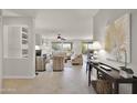 Open living space with neutral tones, comfortable seating, and a fireplace at 18603 N Twilight Way, Surprise, AZ 85374