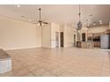 Spacious living room with tile floors and high ceilings at 210 W Yucca Ln, New River, AZ 85087