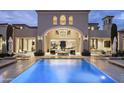 Luxury backyard oasis featuring a large pool and outdoor lounge area at 21487 N 110Th Pl, Scottsdale, AZ 85255