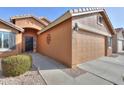 House exterior featuring a walkway to the front door and garage at 2608 E Desert Wind Dr, Casa Grande, AZ 85194