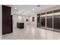 Bright, open-concept kitchen and dining area with large sliding glass doors leading to outdoor space at 2828 N Evergreen St, Buckeye, AZ 85396