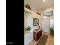 Bright entryway with built-in shelving and antique dresser at 4290 E Strawberry Dr, Gilbert, AZ 85298