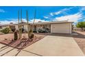 Inviting single-story house featuring desert landscaping with cacti and an attached garage at 5433 E Dodge St, Mesa, AZ 85205