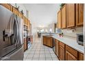 Bright kitchen with stainless steel appliances, light wood cabinets, and tile flooring at 8479 E Sunrise Sky Dr, Gold Canyon, AZ 85118