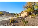 Desert landscape, barrel cactus, and views surrounding a single Gathering home at 10306 E Rising Sun Pl, Gold Canyon, AZ 85118