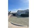 Side view of the house showing a neatly landscaped yard at 10365 W Pinehurst Dr, Sun City, AZ 85351