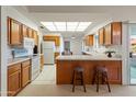 Bright kitchen with wood cabinets, ample counter space, and modern appliances at 12734 W Crystal Lake Dr, Sun City West, AZ 85375