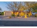 Charming single-story home featuring desert landscaping and a two-car garage at 15838 E Thistle Dr, Fountain Hills, AZ 85268