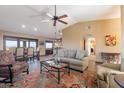 Spacious living room with tile floors, a ceiling fan, and comfortable seating at 15838 E Thistle Dr, Fountain Hills, AZ 85268