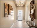 Bright and spacious entryway with high ceilings and elegant chandelier at 15957 E Ridgestone Dr, Fountain Hills, AZ 85268