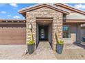 Inviting entryway with stone accents and a charming covered walkway at 17674 E Fort Verde Rd, Rio Verde, AZ 85263