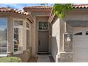 Home's entryway with brown door and sidelights at 1830 S Yucca St, Chandler, AZ 85286