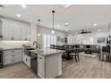 Modern kitchen with granite counters, white cabinets, and stainless steel appliances at 1830 S Yucca St, Chandler, AZ 85286