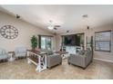 Open-concept living room featuring a farmhouse-style table at 19726 W Morning Glory St, Buckeye, AZ 85326