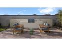 Outdoor kitchen with built-in grill and seating area at 24248 W Agora Ln, Buckeye, AZ 85326