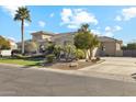 Single-story home with desert landscaping, driveway and arched entryway and windows at 2625 N 24Th St # 36, Mesa, AZ 85213