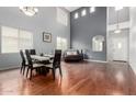 Bright dining room with high ceilings, hardwood floors, and modern chandelier at 29050 N Mountain View Rd, San Tan Valley, AZ 85143