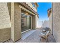 Private patio with wicker chairs and a sliding glass door leading to the interior at 3344 S 82Nd St, Mesa, AZ 85212